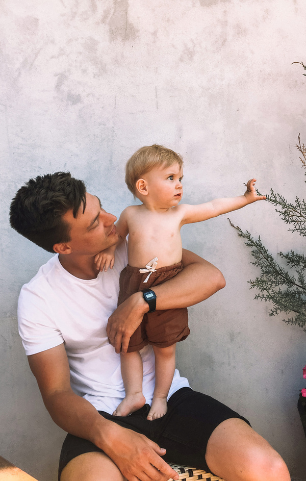 dad holding his kid on lap